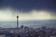 منظره تهران مه گرفته و برج میلاد از بام تهران