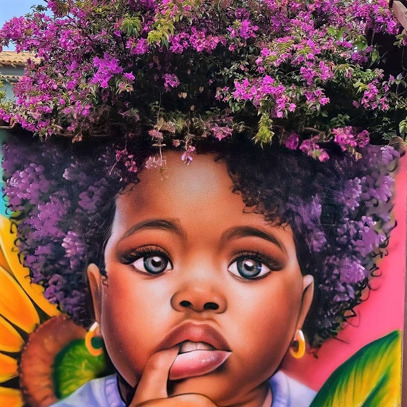 نقاشی دختربچه سیاه پوست روی دیوار